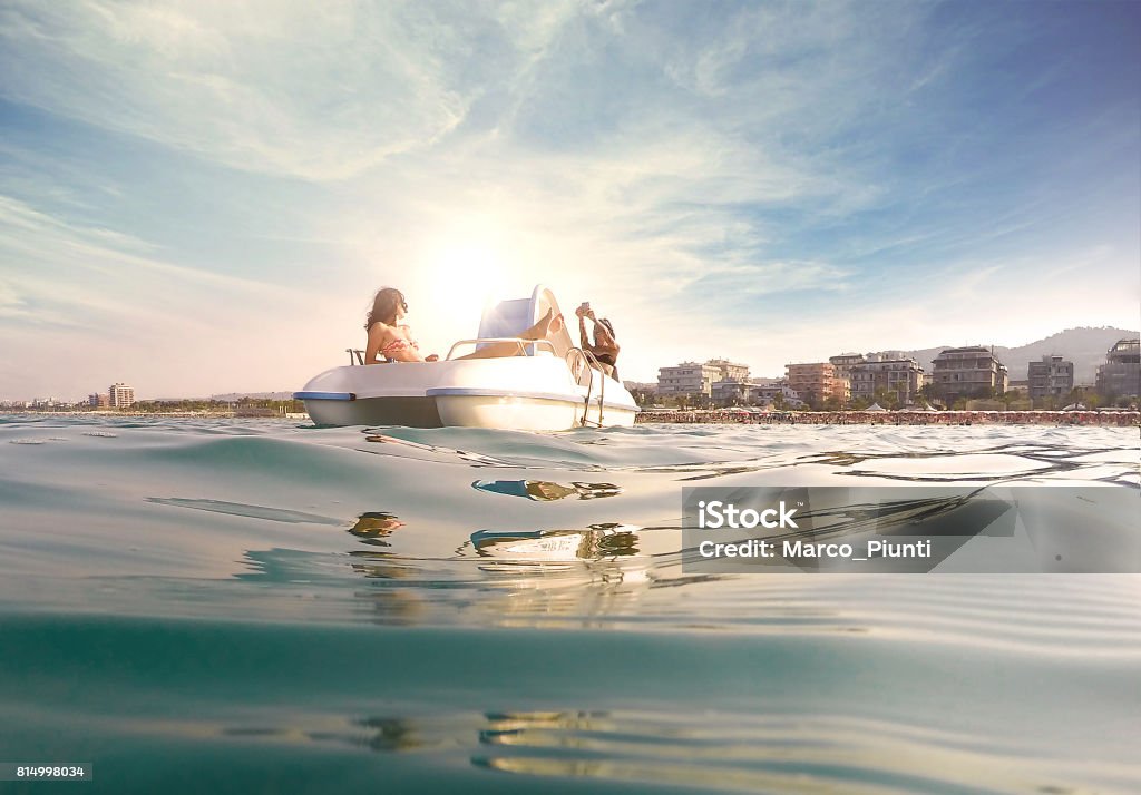 Two young women relaxing on pedal boat Pedal Boat Stock Photo