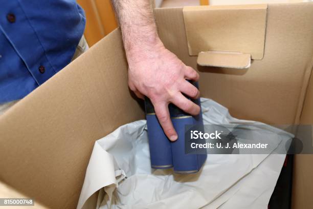 Laying Books Into A Moving Box Stock Photo - Download Image Now - Germany, Horizontal, No People