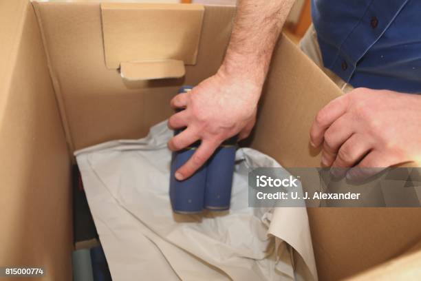 Laying Books Into A Moving Box Stock Photo - Download Image Now - Germany, Horizontal, No People