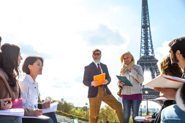 istock Group of students and teacher on a school trip to Paris 815000846