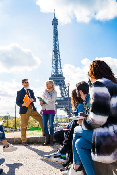 istock Group of students and teacher on a school trip to Paris 815000866