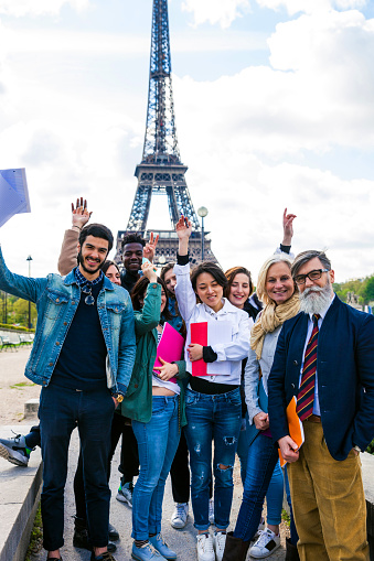 Group of students and teacher on a school trip to Paris, France.