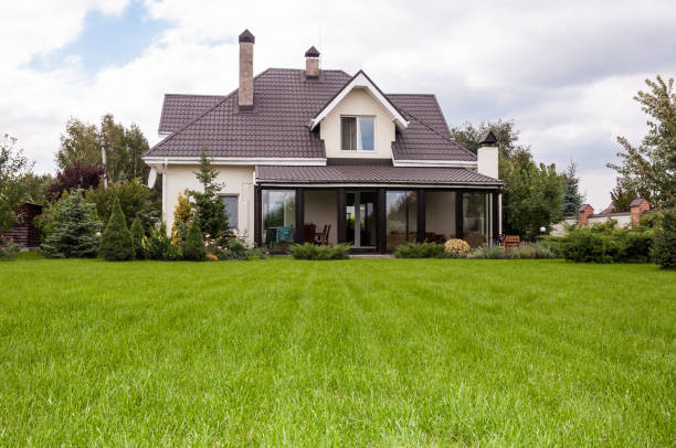 istock Private house with a garden in a rural area under beautiful sky 815000982