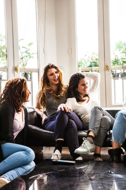 istock Happy friends relaxing on the couch 815001056