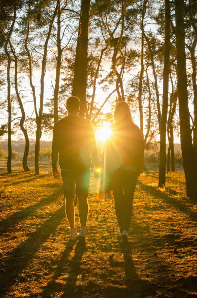 young men and women leaving the path