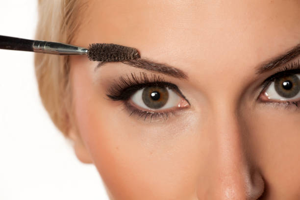 istock closeup of eyebrow shaping with brush 815001700
