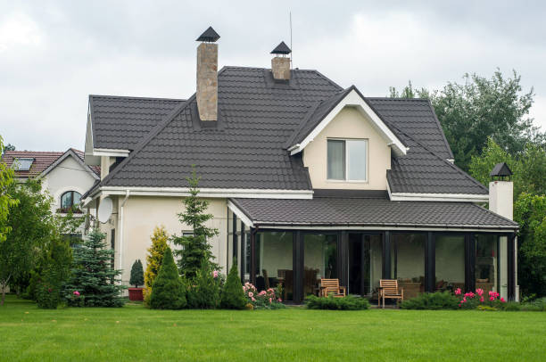 istock Private house with a garden in a rural area under sky 815003894