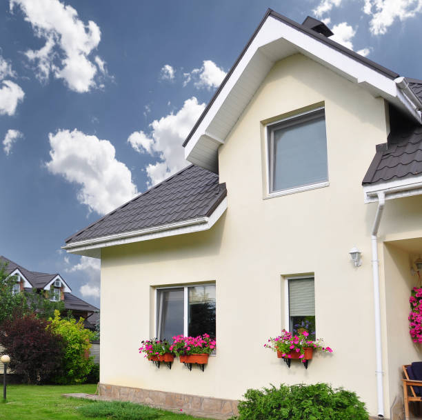 istock Private house with a garden in a rural area under beautiful sky 815004010