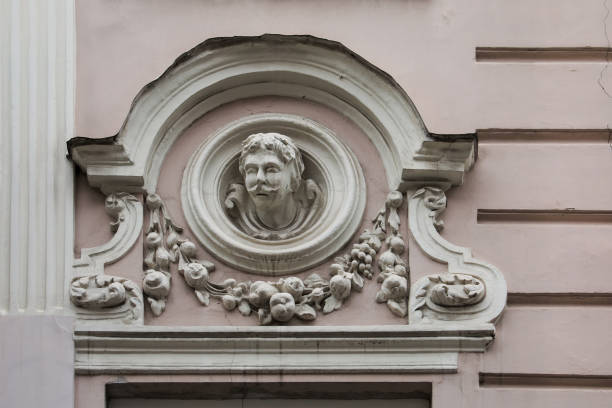 istock Relief on facade of old building, mascaron ornament 815004018