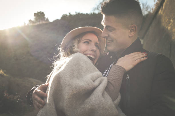 istock Happy couple in embracing looking each other and smiling. 815008256