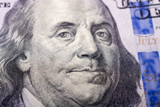 istock Close up of Benjamin Franklin face on US dollar 815008722