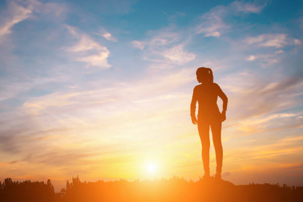 istock silhouette of a happy people and sunset 815011536