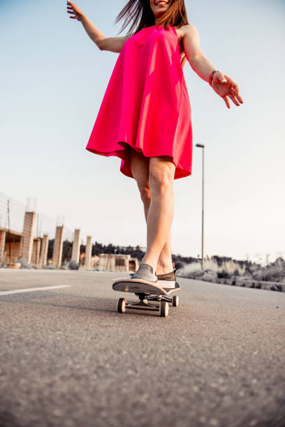istock Beautiful Young Woman Enjoying Skateboarding 815015012