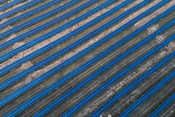 istock Solar panels placed on a countryside meadow. 815015122