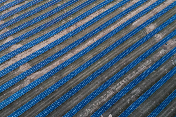 istock Solar panels placed on a countryside meadow. 815015170