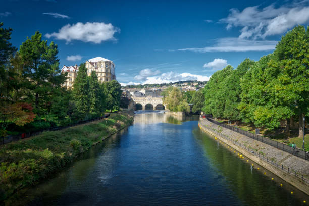 istock Bath riverside on a summer morning day with the old town peeking in the backdrop 815018378