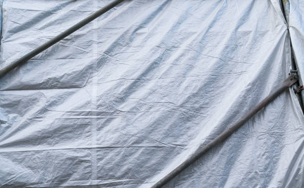 istock gray tarp covering a building for backgrounds 815021994