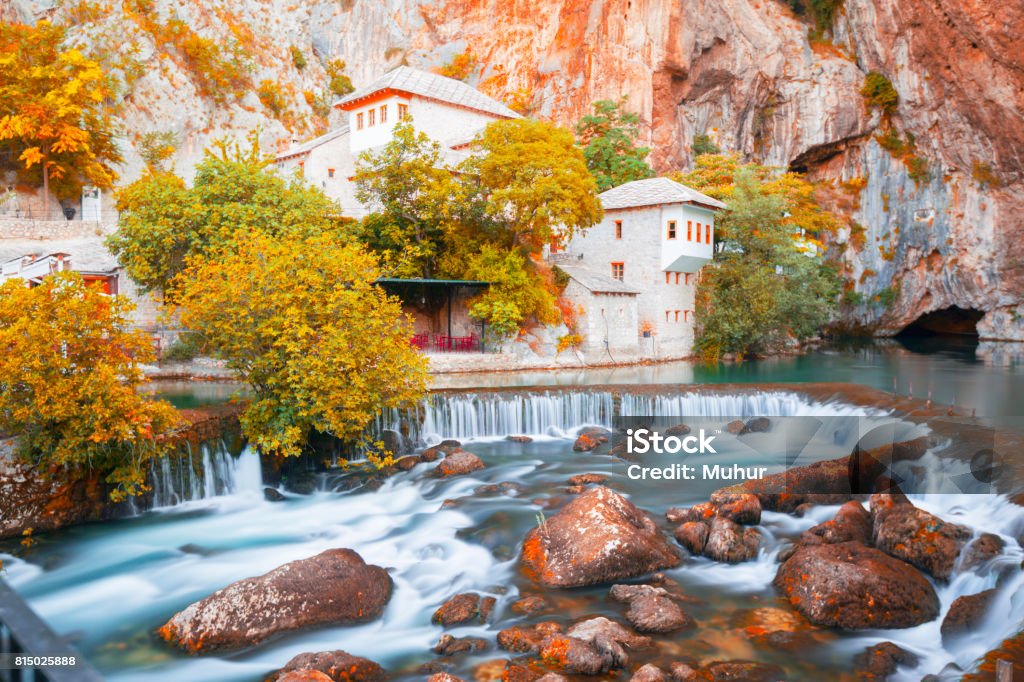Dervish house on Buna spring with a small waterfall and a cave nearby in a sunny summer day in Blagaj, Bosnia and Herzegovina Adult Stock Photo