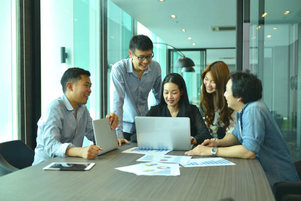 istock Teamwork of Asian business people succeed a project, tag team 815026246