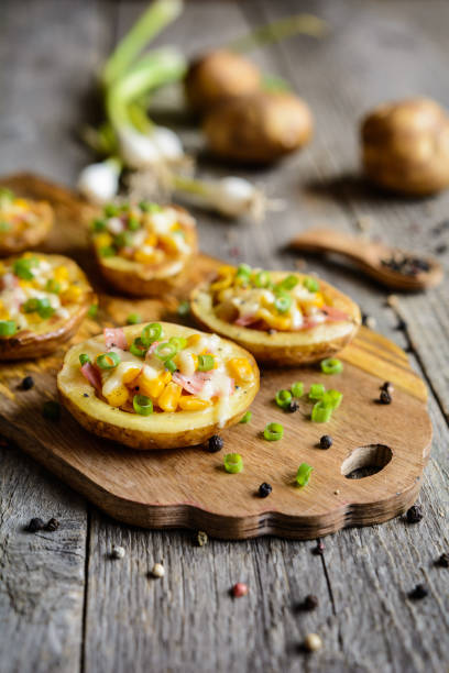 istock Potato boats filled with corn, ham, cheese and green onion 815028650