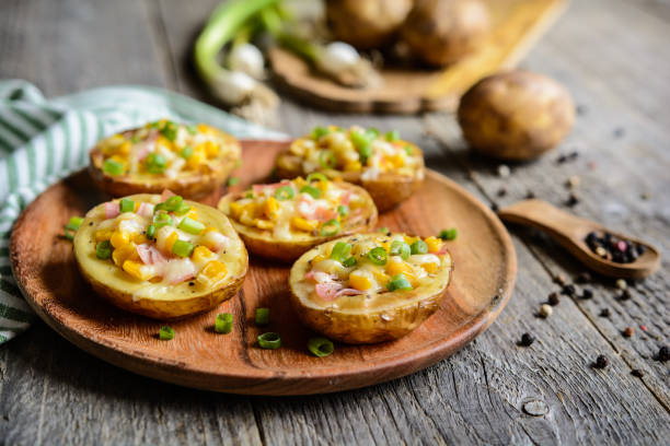 istock Potato boats filled with corn, ham, cheese and green onion 815028714