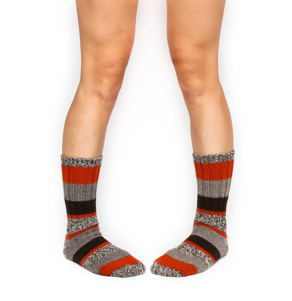 istock Beautiful female legs in colorful socks 815036086