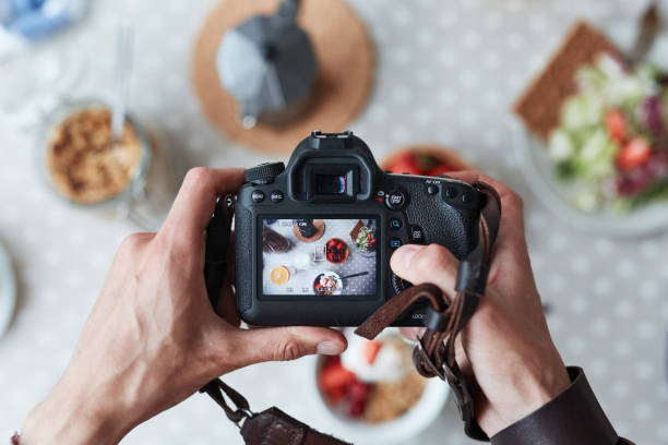 Food shot Professional food-photographer making shot of food for advert food styling stock pictures, royalty-free photos & images