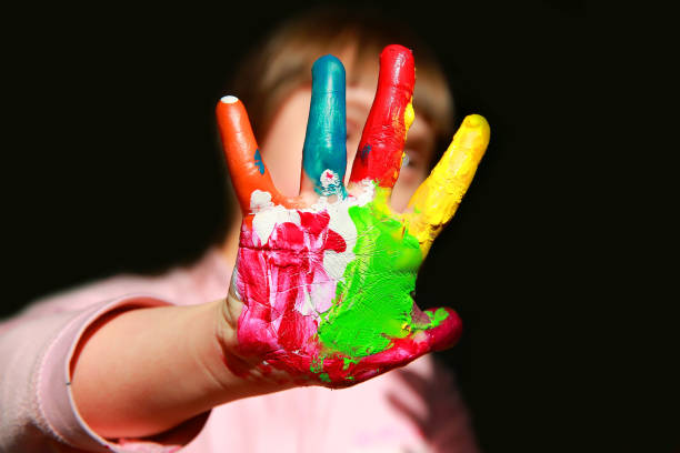 istock Cute little kid with painted hand 815039586
