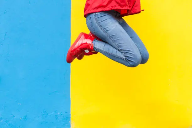 Photo of Woman in red sneakers