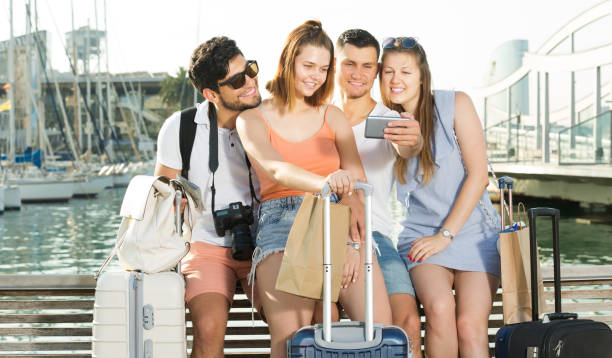 istock Guys and girls taking selfie  on waterfront 815056368