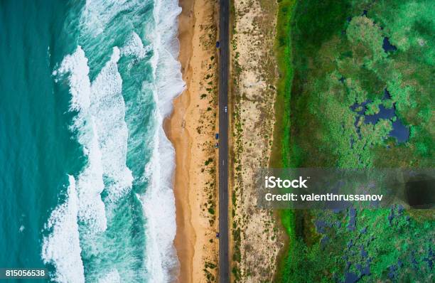 Sea Waves Beach And Road Stock Photo - Download Image Now - Aerial View, Geographical Border, Water