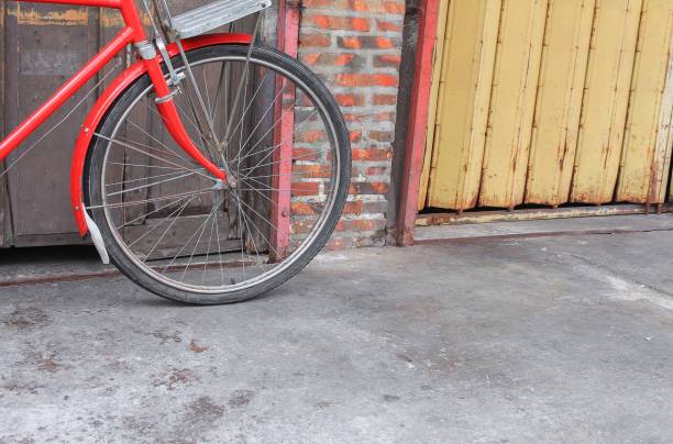 istock bicycle red  classic vintage in former on wall wood background with copy space for add text 815056584