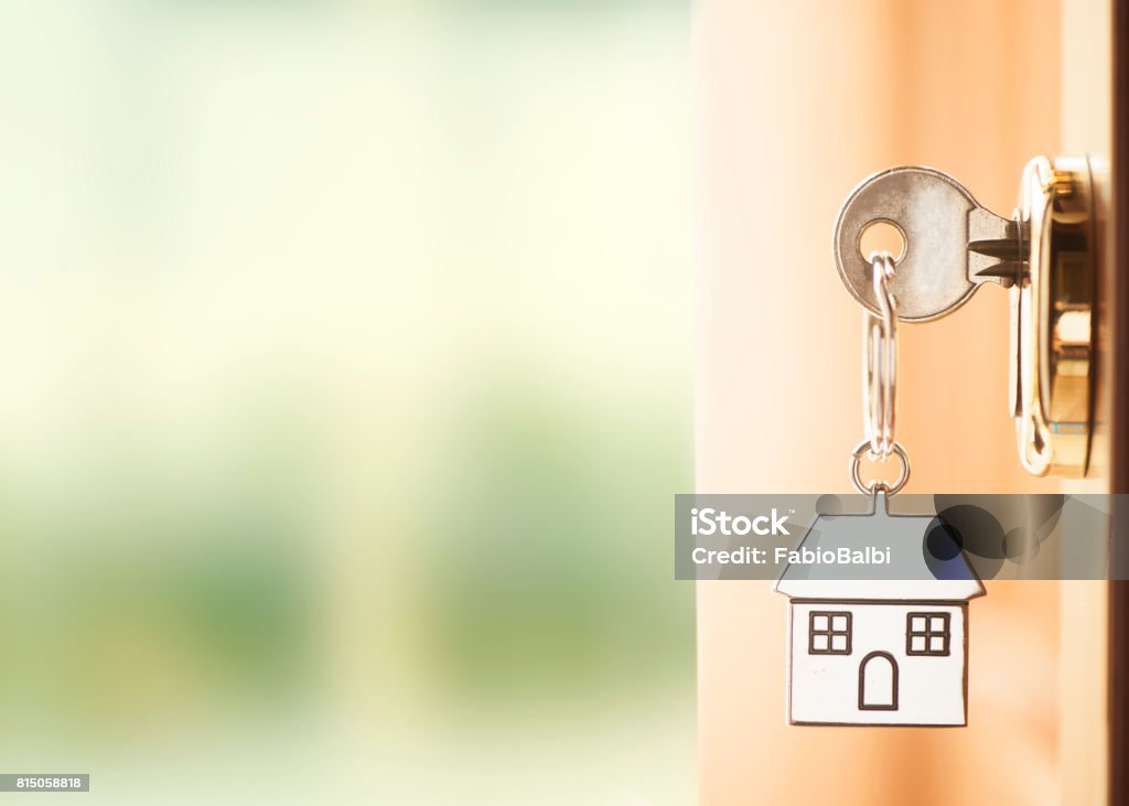 Front door with house keys Front door with house keys with outside wiew House Key Stock Photo