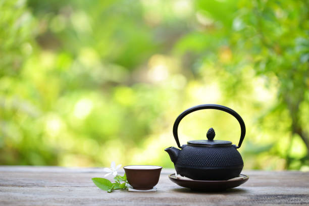 istock Black vintage teapot and cup  at outdoor 815059146