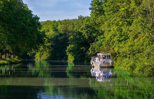 Boat on Canal du Midi, travel by barge and vacation in Southern France