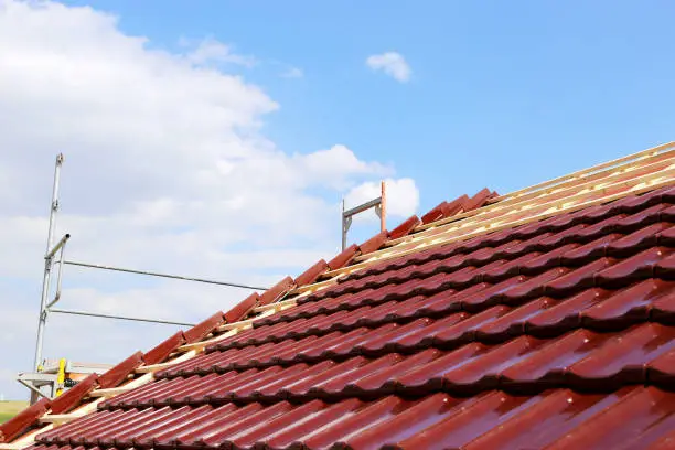 Roofing contractors working on a new roof