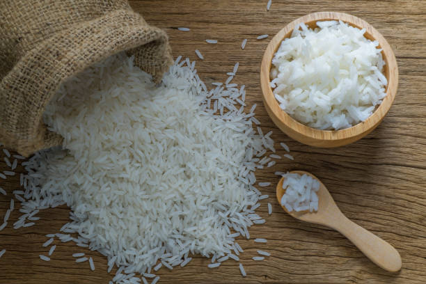 istock Cooked jasmine rice in wooden bowl and spoon 815074274