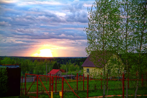 istock a ray of sun at sunset through clouds 815111492