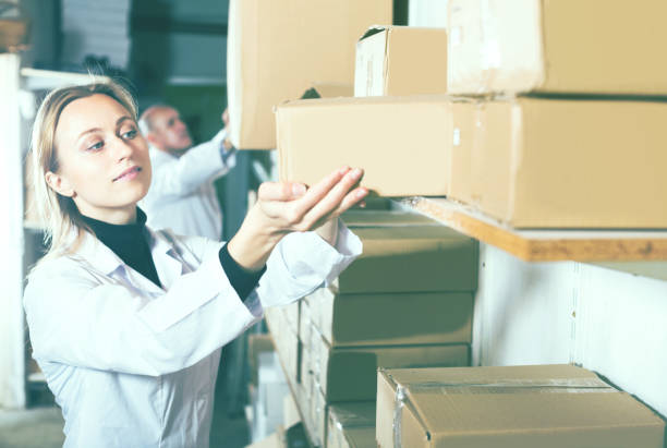 istock Couple transporting cart cardboard cases 815117798