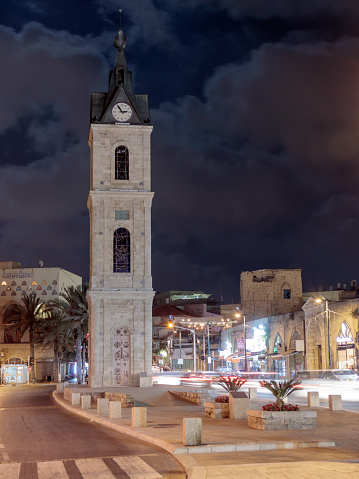 Tel Aviv -Yafo, Israel, July 08, 2016: Old Clock Tower at night in old city Yafo, Israel. It's limestone clock tower built in 1903 to honor one of the last sultans of the Ottoman Empire.