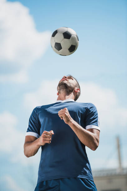 istock low angle view of soccer player training with ball on soccer pitch 815130362