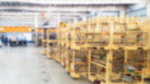 istock abstract blur :worker team meeting and package storage inside factory 815146940