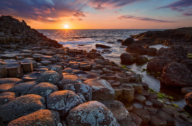 istock sunset over basalt columns Giant's Causeway, County Antrim, Northern Ireland 815160190