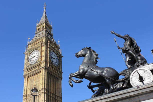 view of big ben, london, uk London, england - may 26,2017: view of big ben through bronze sculptural group of boadicea and her daughters at the westminster bridge, london, uk boadicea statue stock pictures, royalty-free photos & images