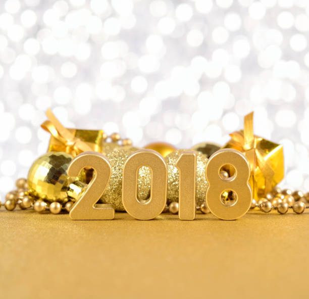 istock 2018 year golden figures on a bokeh background 815166410