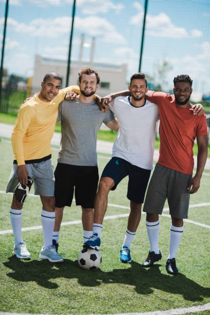 istock multiethnic soccer team standing on soccer pitch after game 815166868