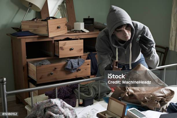 Burglar Stealing Items From Bedroom During House Break In Stock Photo - Download Image Now