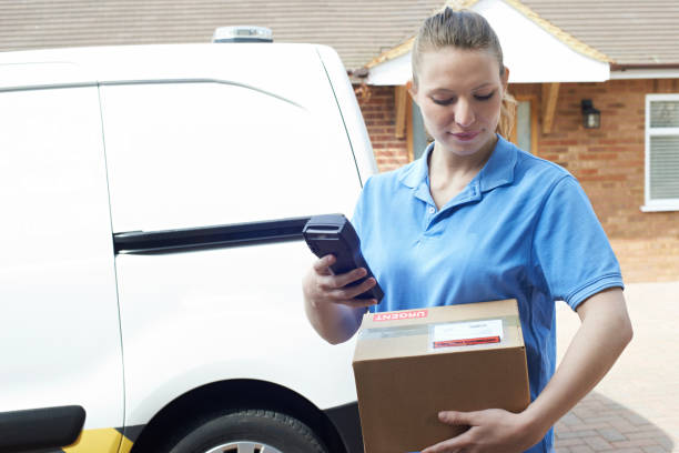 istock Female Courier Delivering Package To Domestic House 815185886