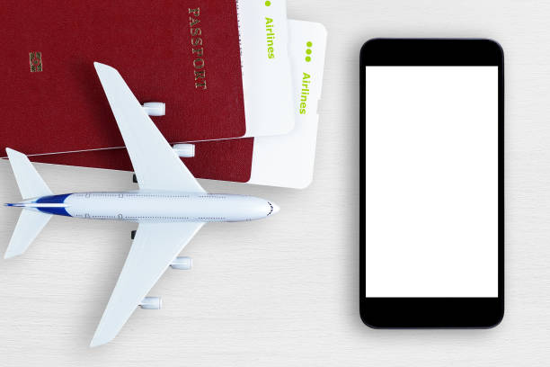 istock Air tickets, passports, smartphone, and toy plane 815186542