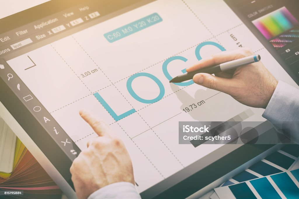 Graphic designer at work. Color samples. logo design brand designer sketch graphic drawing creative creativity draw studying work tablet concept - stock image Graphic Designer Stock Photo